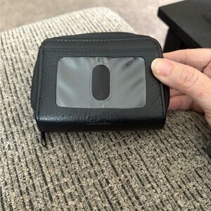 Buxton Solid Colored Black Pebbled
Multi Card Wizard wallet.